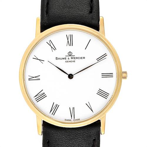 The image shows a front view of a Baume & Mercier Classima MV045088 Men's Yellow Gold White Dial MV045088 Men's Yellow Gold White Dial watch with a gold case, white dial, and black leather strap.