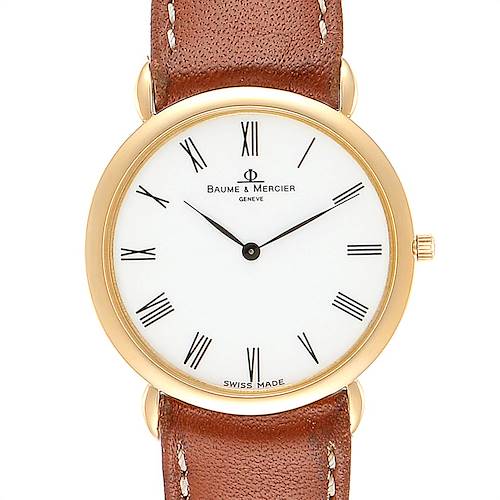 The image shows a front view of a Baume & Mercier Classima 15606 Men's Yellow Gold White Dial 15606 Men's Yellow Gold White Dial watch with a brown leather strap.