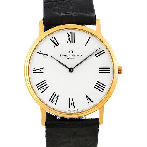 The image shows a frontal view of the Baume & Mercier MV045088 Men's Yellow Gold White Dial MV045088 Men's Yellow Gold White Dial model MV045088 men's 18K quartz watch, displaying its face, hands, and part of its strap.