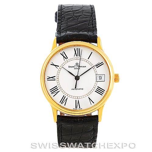 This image shows a front view of the Baume & Mercier Classima MV045075 Men's Yellow Gold White Dial MV045075 Men's Yellow Gold White Dial watch, featuring a gold case, white dial, Roman numeral indices, and a black leather strap.