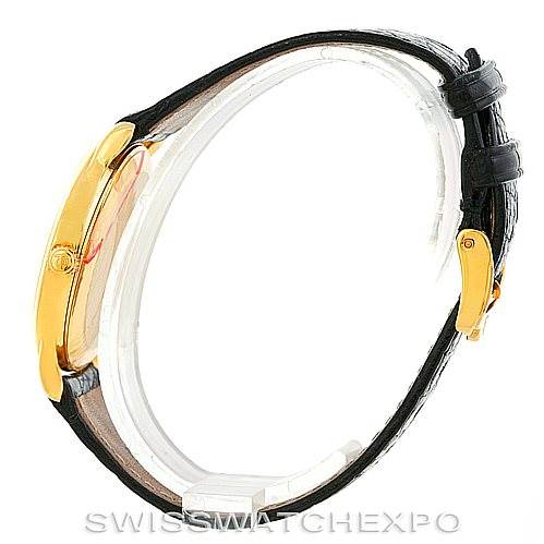 Side view of a Baume & Mercier Classima MV045075 Men's Yellow Gold White Dial MV045075 Men's Yellow Gold White Dial watch, showing its gold case and black leather strap.