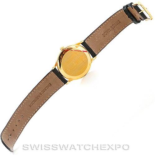 This image shows the back and strap of a Baume & Mercier Classima MV045075 Men's Yellow Gold White Dial MV045075 Men's Yellow Gold White Dial watch, highlighting the case back, leather strap, and buckle.