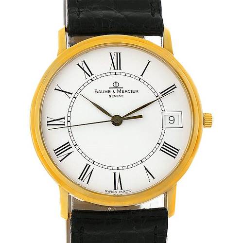 The image shows a frontal view of a Baume & Mercier Classima 95712 Men's Yellow Gold White Dial 95712 Men's Yellow Gold White Dial watch, highlighting its face, hands, Roman numerals, and date window.