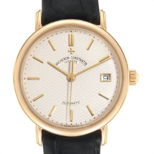 This image shows a front view of the Vintage Vacheron Constantin watch, displaying its dial, gold case, hands, crown, and date window.