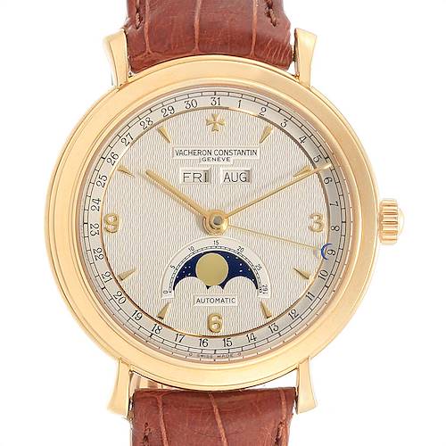 The image shows a frontal view of the Vacheron Constantin Vintage 47050 Men's Yellow Gold Silver Dial 47050 Men's Yellow Gold Silver Dial model watch with its dial, hands, date, day, month indicators, and moon phase.