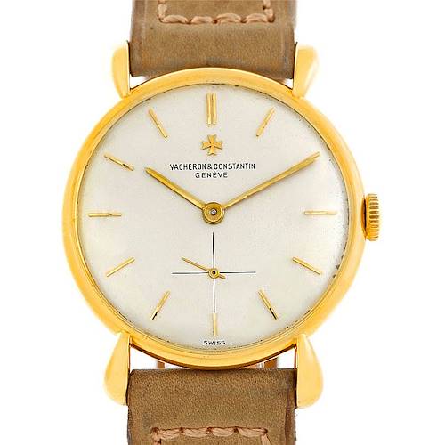 The image shows a front view of a vintage Vacheron Constantin watch in a gold case with a leather strap.