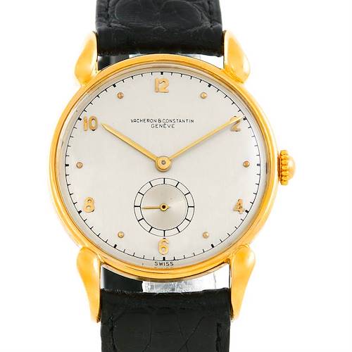 This image shows a frontal view of a Vintage Vacheron Constantin watch, highlighting its gold case, dial, hands, and black leather strap.