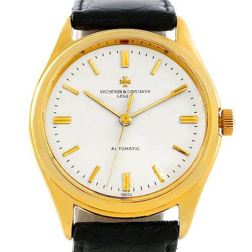 This image shows a frontal view of a Vintage Vacheron Constantin watch with a gold case and a black leather strap.
