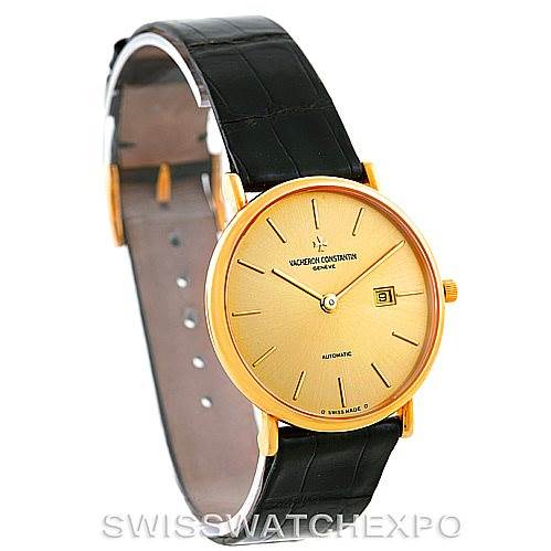 The image shows a side-angle view of the Vacheron Constantin Vintage 48002 Men's Yellow Gold Champagne Dial 48002 Men's Yellow Gold Champagne Dial watch, highlighting its round gold dial, black leather strap, and date window.