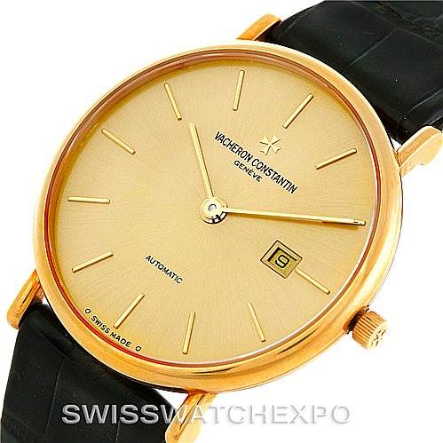 This Vacheron Constantin Vintage 48002 Men's Yellow Gold Champagne Dial 48002 Men's Yellow Gold Champagne Dial watch is shown from an angled top-down view, highlighting the gold dial, hands, and black leather strap.
