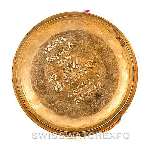 This image shows the inner case back of a vintage Vacheron Constantin watch, highlighting the brand's engravings and hallmarks.
