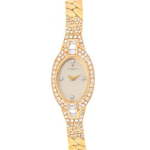 The image shows a Vacheron Constantin Vintage Women's Yellow Gold Silver Dial Women's Yellow Gold Silver Dial watch from the front, highlighting its oval face, gold band, and diamond accents.
