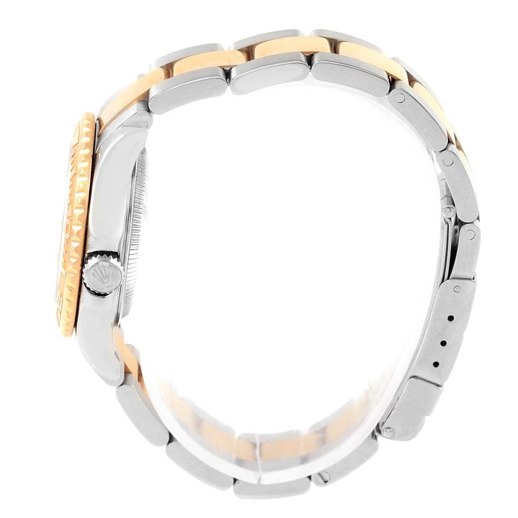 This image shows a side view of a Rolex Yacht-Master 169623 Women's Steel and Gold (two tone) White Dial 169623 Women's Steel and Gold (two tone) White Dial watch, highlighting the crown, bezel, and the two-tone bracelet.