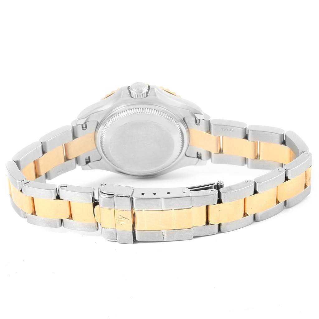 The image shows the back view of the Rolex Yacht-Master 169623 Women's Steel and Gold (two tone) White Dial 169623 Women's Steel and Gold (two tone) White Dial watch with a silver and gold Oyster bracelet.