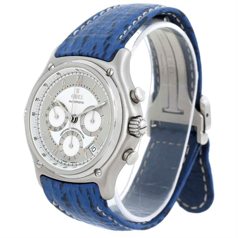 The image shows an angled view of the Ebel 9137241 Stainless Steel Silver Dial 9137241 Stainless Steel Silver Dial Le Modulor Automatic Chronograph Blue Strap Watch 9137241, highlighting the face, bezel, crown, and strap.
