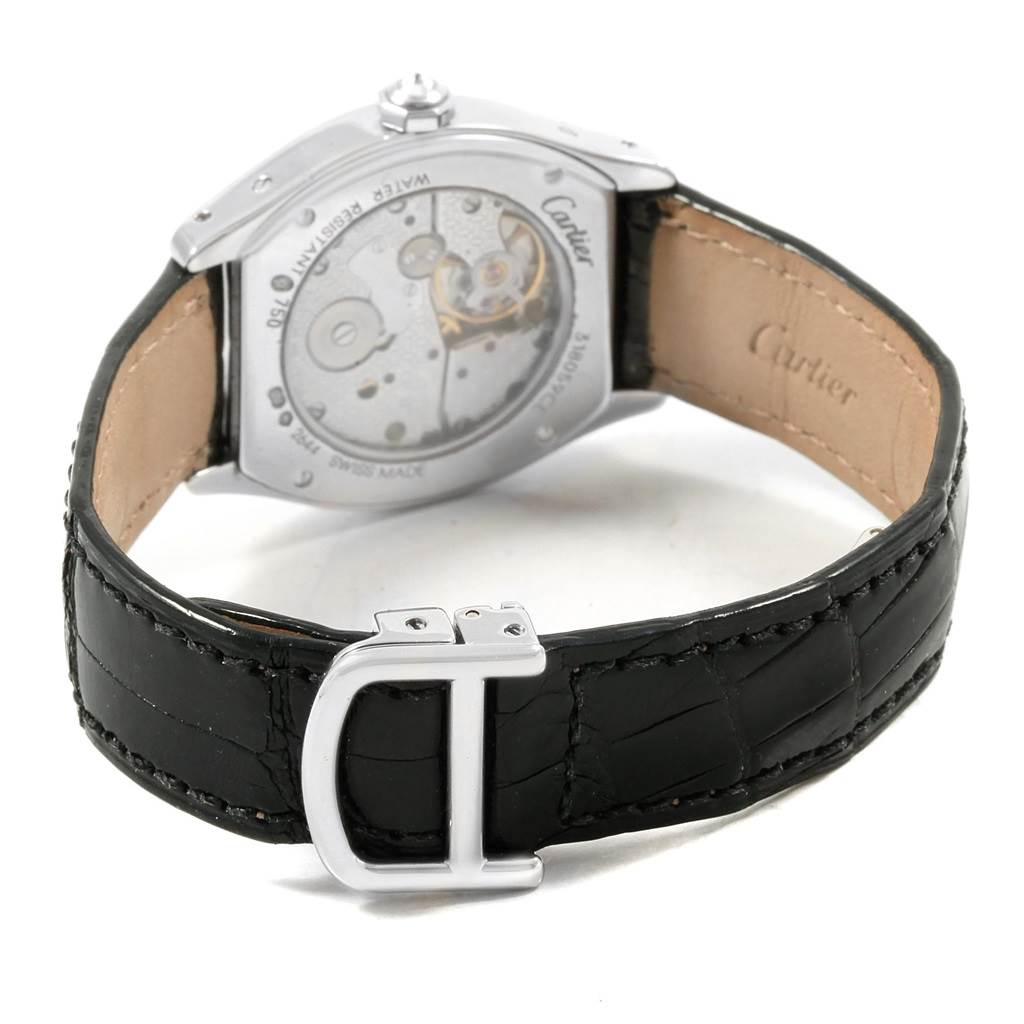 The image shows the back of a Cartier Tortue WA507231 Women's White Gold Silver Dial WA507231 Women's White Gold Silver Dial watch, highlighting the movement, case back, and leather strap with a buckle.