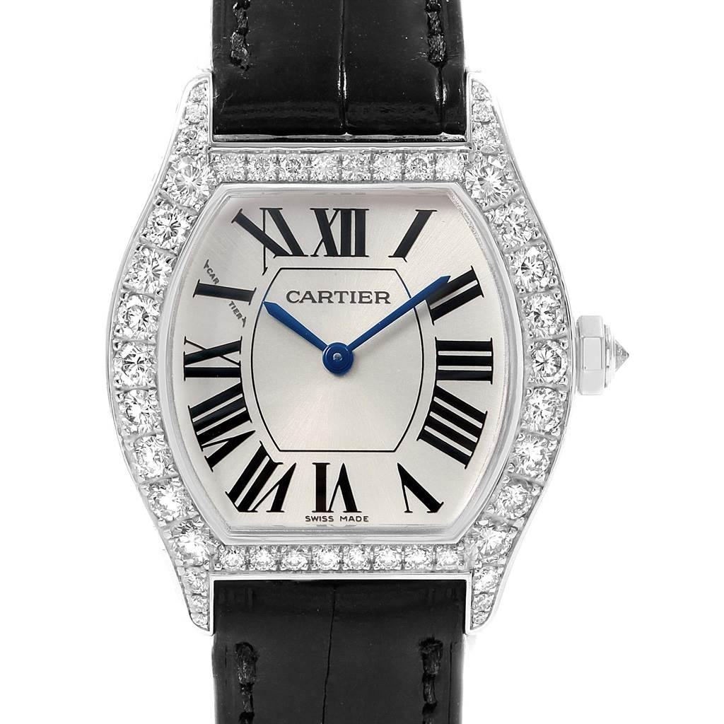 This image shows a front view of the Cartier Tortue WA507231 Women's White Gold Silver Dial WA507231 Women's White Gold Silver Dial watch, highlighting its diamond bezel, Roman numerals, and black leather strap.
