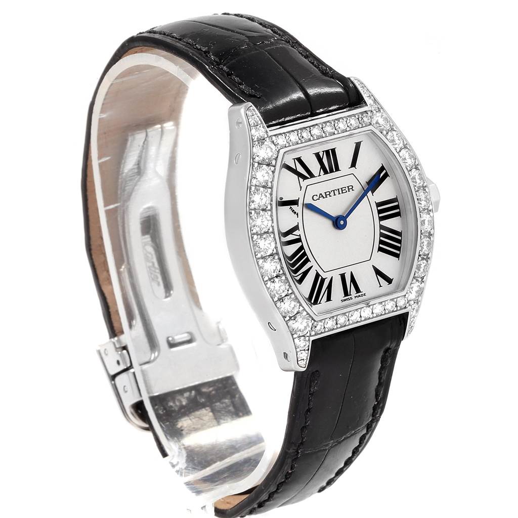 The image shows a Cartier Tortue WA507231 Women's White Gold Silver Dial WA507231 Women's White Gold Silver Dial watch at a front-left angle, highlighting its face, bezel, and black leather strap.