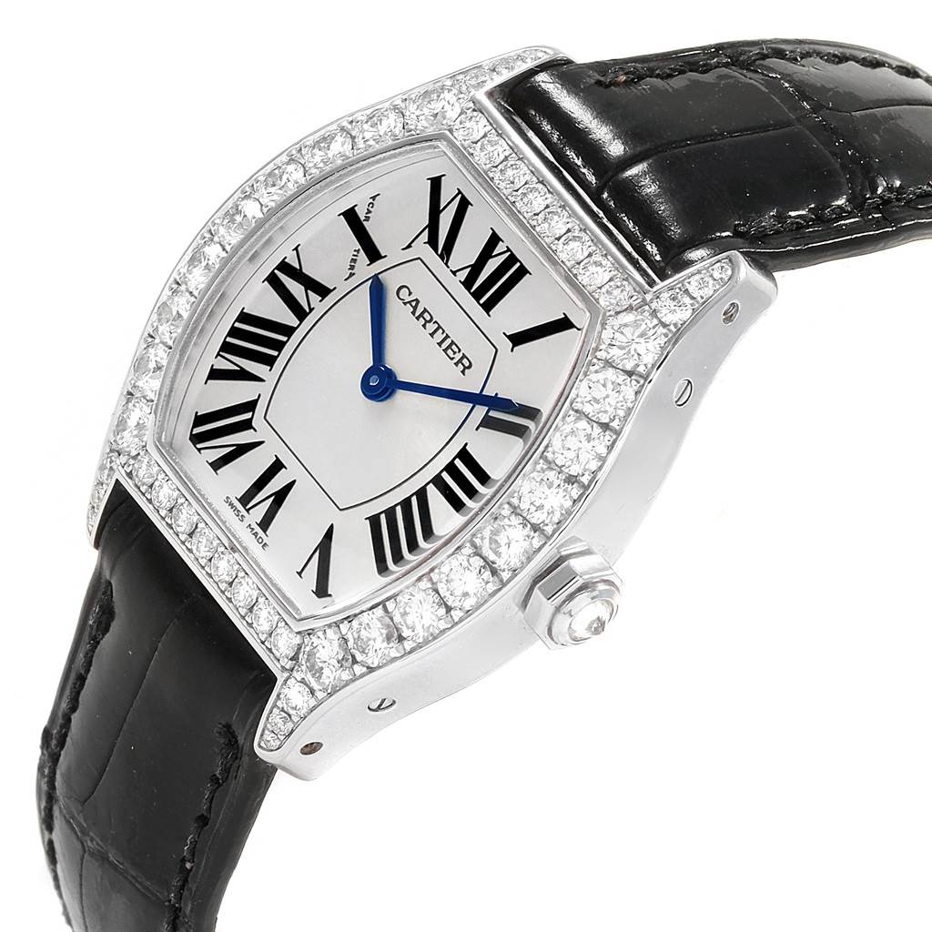 The image shows a Cartier Tortue WA507231 Women's White Gold Silver Dial WA507231 Women's White Gold Silver Dial watch from an angled side view showcasing its face, bezel, and crown.