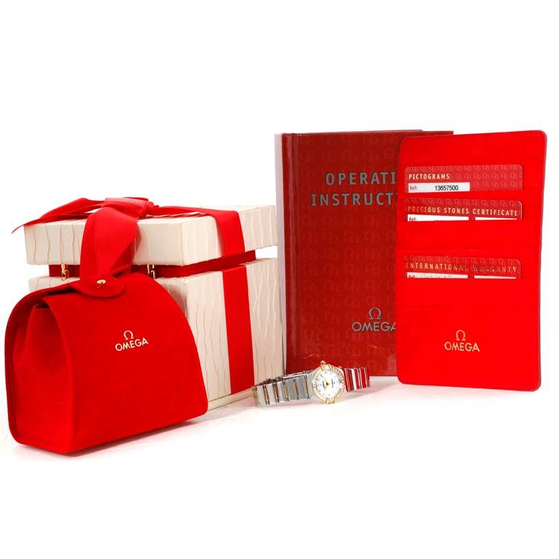 The image shows the Omega 1365.75.00 Women's Steel and Gold (two tone) Mother of Pearl Dial 1365.75.00 Women's Steel and Gold (two tone) Mother of Pearl Dial Constellation Mini Steel Yellow Gold Diamond Watch 1365.75.00 with its box, manual, certificates, and a red pouch.