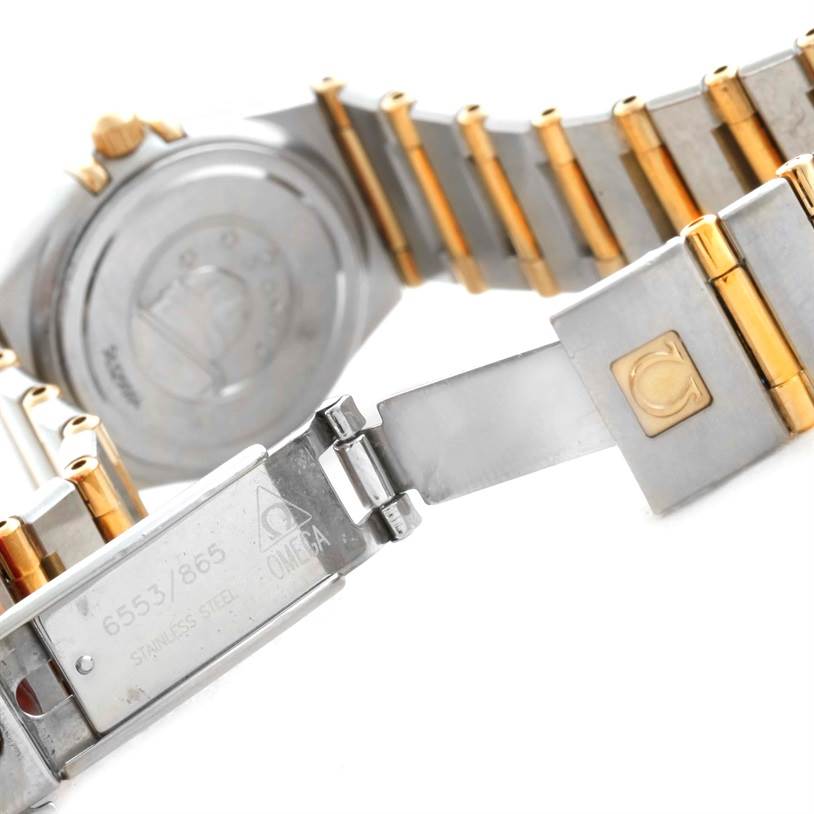 The image shows the clasp and part of the bracelet of the Omega 1267.75.00 Women's Steel and Gold (two tone) Mother of Pearl Dial 1267.75.00 Women's Steel and Gold (two tone) Mother of Pearl Dial Constellation My Choice Mini Steel Gold Diamond Watch 1267.75.00.
