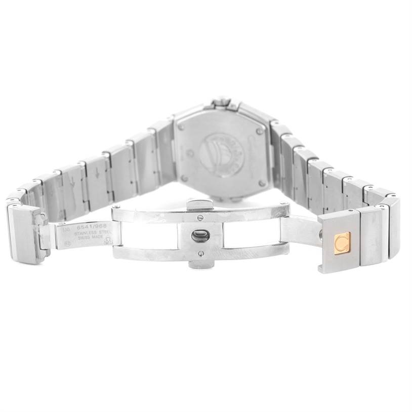 The image shows the back side and clasp of the Omega 123.15.27.60.55.002 Women's Stainless Steel Mother of Pearl Dial 123.15.27.60.55.002 Women's Stainless Steel Mother of Pearl Dial Constellation 27mm Diamond Ladies Watch model 123.15.27.60.55.002.