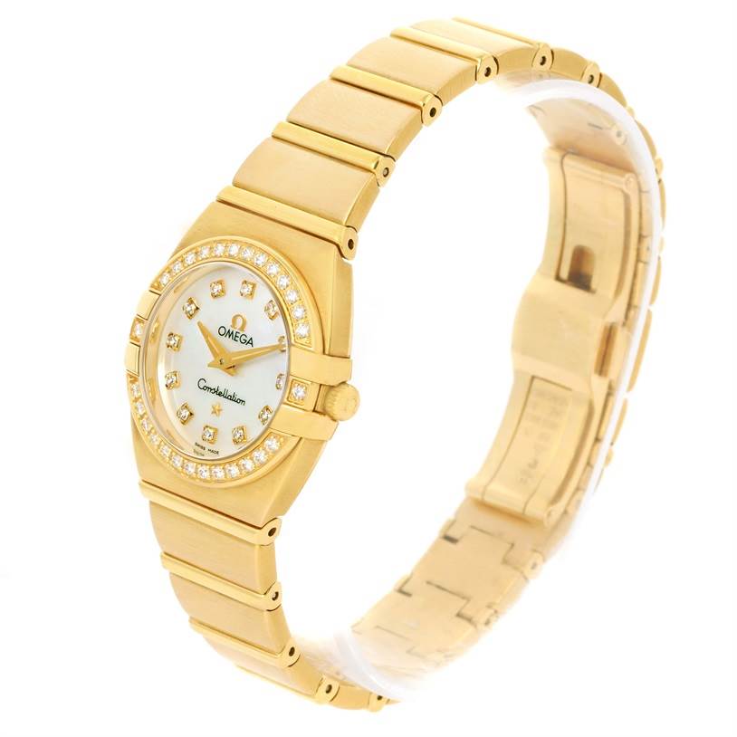 The image shows an angled view of an Omega 1189.75.00 Women's Yellow Gold Mother of Pearl Dial 1189.75.00 Women's Yellow Gold Mother of Pearl Dial Constellation Double Eagle Yellow Gold Diamond Watch 1189.75.00, highlighting the dial, bezel, and bracelet.