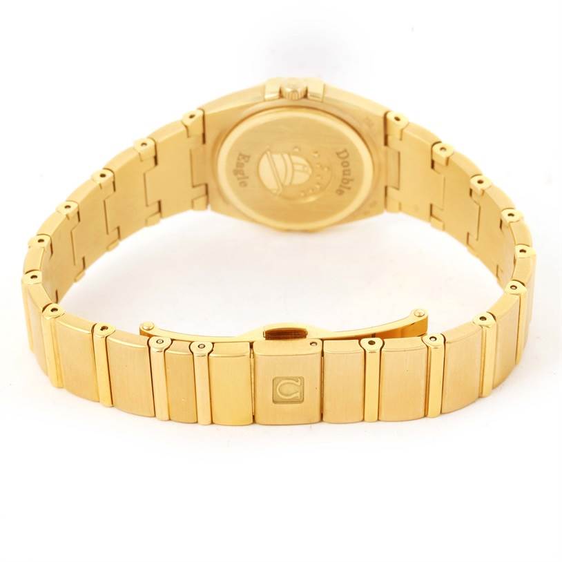 The image shows the back and bracelet of the Omega 1189.75.00 Women's Yellow Gold Mother of Pearl Dial 1189.75.00 Women's Yellow Gold Mother of Pearl Dial Constellation Double Eagle Yellow Gold Diamond Watch 1189.75.00.