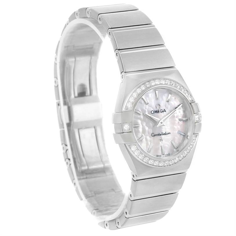 The image shows an angled view of the Omega 123.15.27.60.05.001 Women's Stainless Steel Mother of Pearl Dial 123.15.27.60.05.001 Women's Stainless Steel Mother of Pearl Dial Constellation 27mm Diamond Ladies Watch 123.15.27.60.05.001, highlighting its face, bezel, and band.