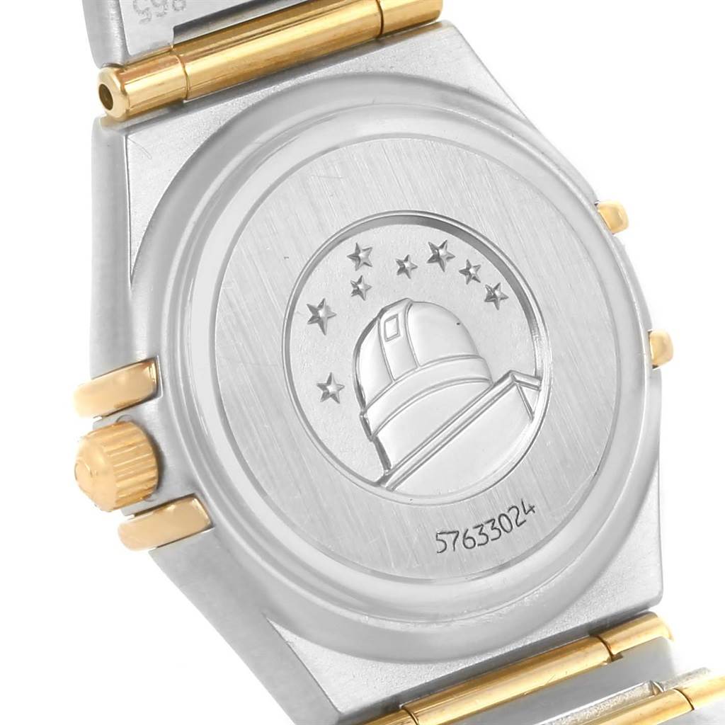 The image shows the case back and part of the bracelet of an Omega 1267.75.00 Women's Steel and Gold (two tone) Mother of Pearl Dial 1267.75.00 Women's Steel and Gold (two tone) Mother of Pearl Dial Constellation My Choice Mini Steel Gold Diamond Watch model 1267.75.00.