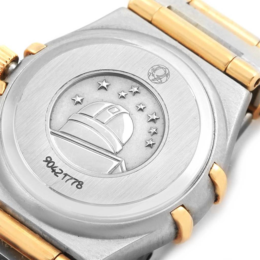 The image shows the back case of the Omega 1267.75.00 Women's Steel and Gold (two tone) Mother of Pearl Dial 1267.75.00 Women's Steel and Gold (two tone) Mother of Pearl Dial Constellation My Choice Mini Steel Gold Diamond Watch 1267.75.00, displaying engraving details.