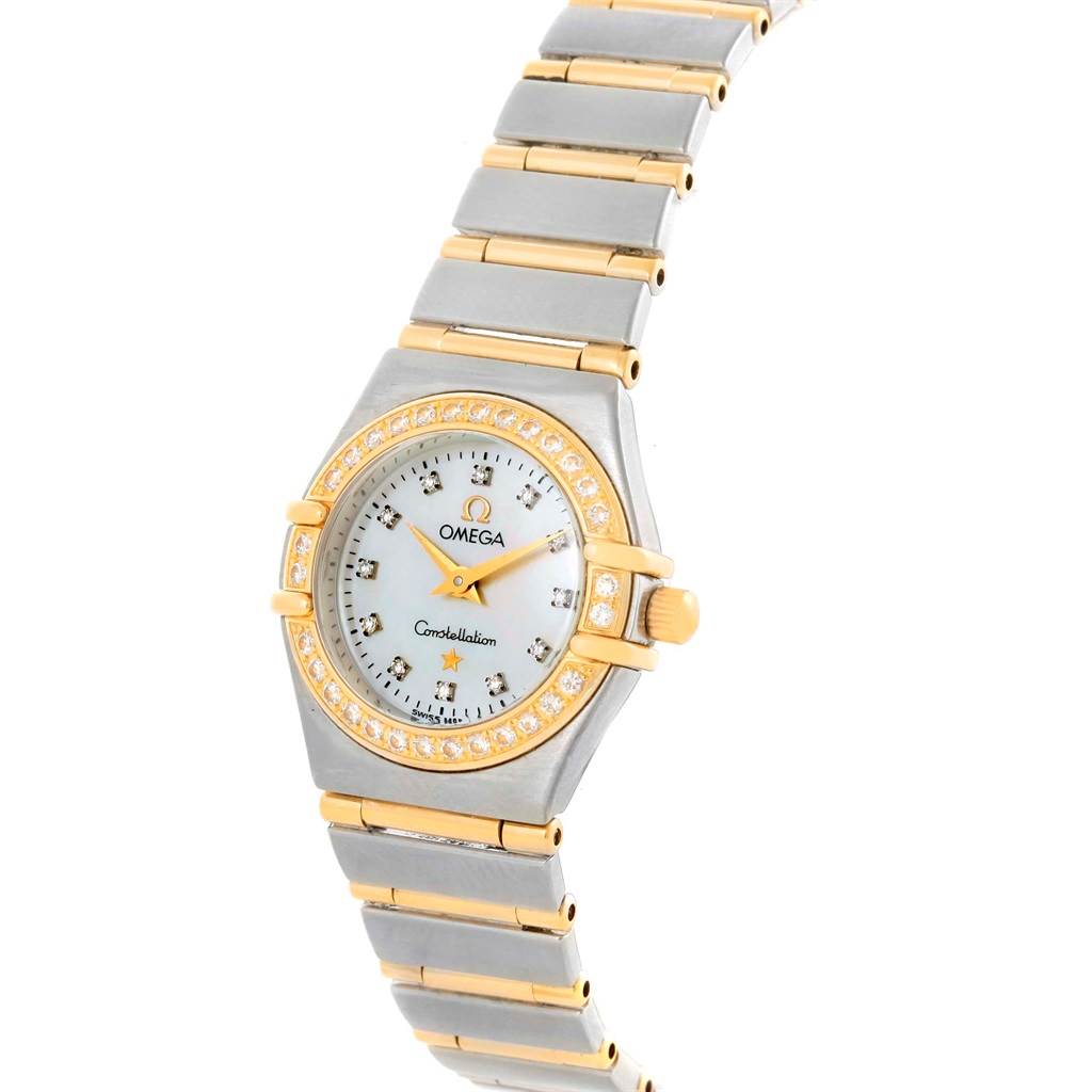 The image shows an Omega 1267.75.00 Women's Steel and Gold (two tone) Mother of Pearl Dial 1267.75.00 Women's Steel and Gold (two tone) Mother of Pearl Dial Constellation My Choice Mini MOP Diamond Ladies Watch 1267.75.00 from a top angle, highlighting the dial, bezel, and bracelet.