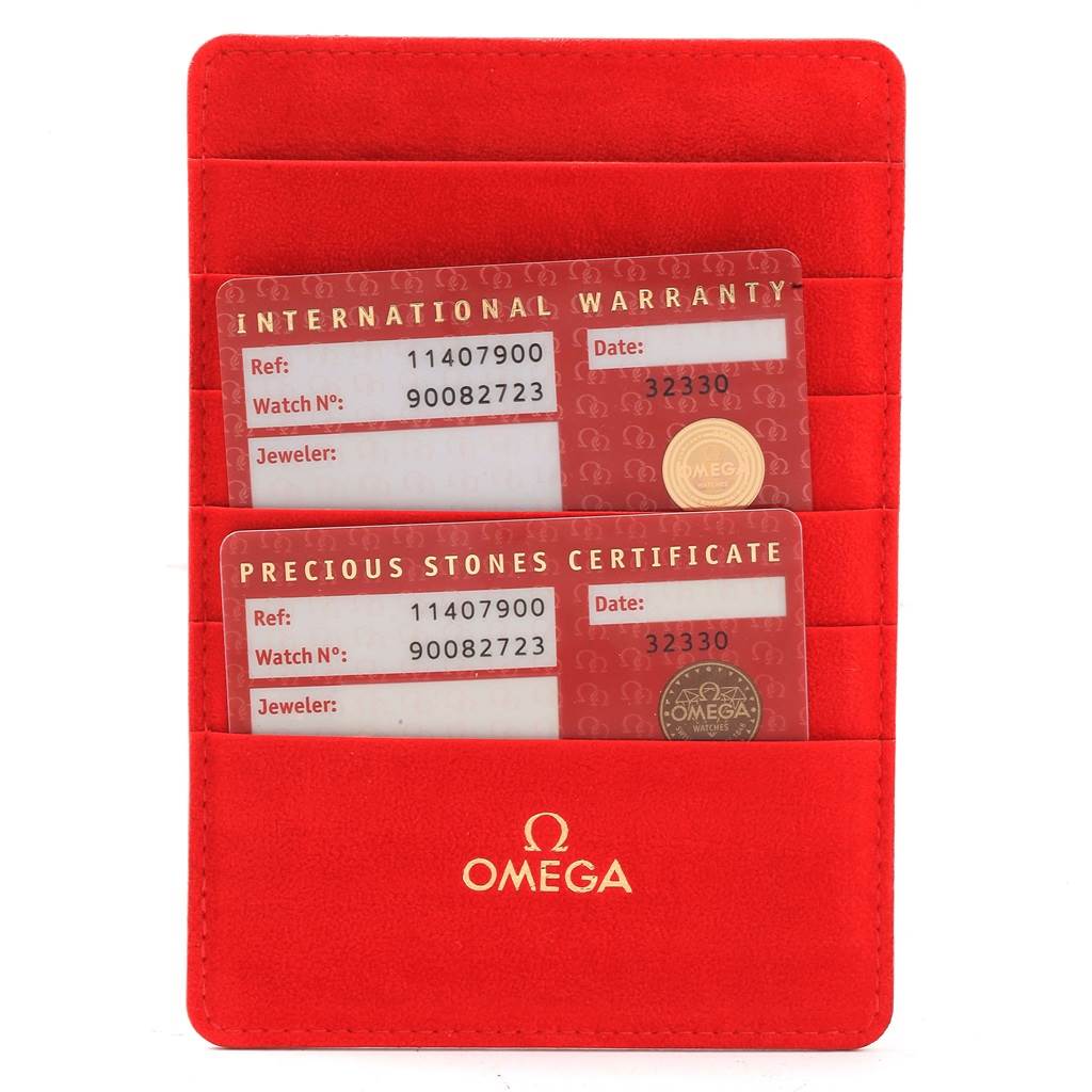 The image shows two cards, the International Warranty and Precious Stones Certificate, in a red Omega 1140.79.00 Women's Rose Gold Mother of Pearl Dial 1140.79.00 Women's Rose Gold Mother of Pearl Dial cardholder.