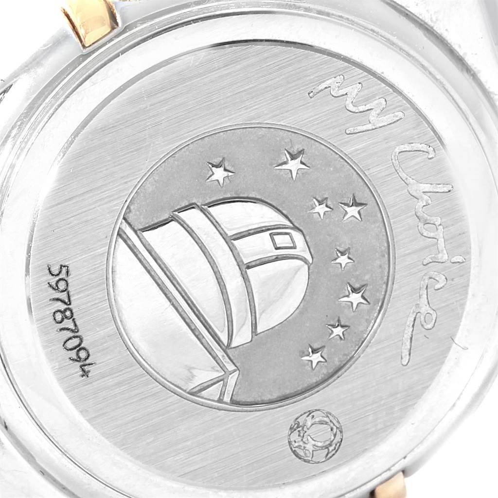 The image shows the back case of the Omega 1365.79.00 Women's Steel and Gold (two tone) Mother of Pearl Dial 1365.79.00 Women's Steel and Gold (two tone) Mother of Pearl Dial Constellation Iris Steel Yellow Gold Multi Stone Watch 1365.79.00, featuring an observatory and stars design.