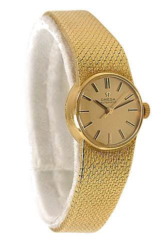 This image shows the front and side angle of the Omega 7169 Women's Yellow Gold Champagne Dial 7169 Women's Yellow Gold Champagne Dial Vintage Ladies 18K Yellow Gold 7169 Watch, highlighting the dial, bezel, and band.