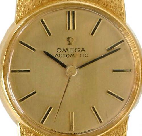 The image shows a frontal view of the Omega 7169 Women's Yellow Gold Champagne Dial 7169 Women's Yellow Gold Champagne Dial Vintage Ladies 18k Yellow Gold 7169 Watch, focusing on its dial and hands.