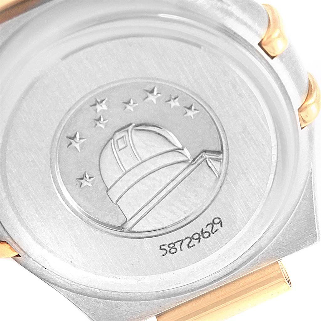 The image shows the back of the Omega 1267.75.00 Women's Steel and Gold (two tone) Mother of Pearl Dial 1267.75.00 Women's Steel and Gold (two tone) Mother of Pearl Dial Constellation Mini Mother of Pearl Diamond Watch 1267.75.00 with an observatory embossment.