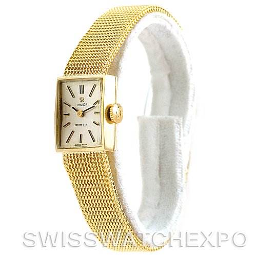 The image shows a side angle of the Vintage Ladies 14k Yellow Gold Omega Women's Yellow Gold Silver Dial Women's Yellow Gold Silver Dial watch made for Tiffany, highlighting the mesh band and face.