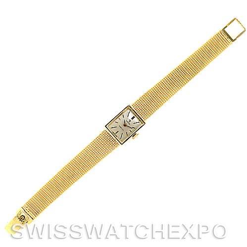 This image shows a top view of the Omega Women's Yellow Gold Silver Dial Women's Yellow Gold Silver Dial Vintage Ladies 14k Yellow Gold Watch Made For Tiffany, displaying its gold mesh band and square face.