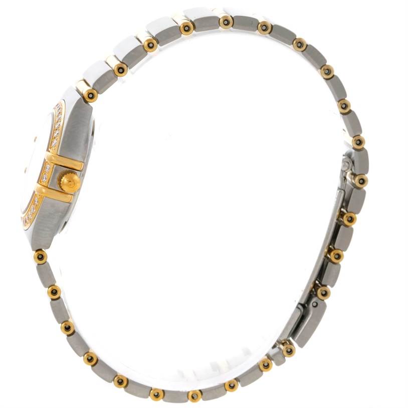 The image shows a side view of the Omega 1267.75.00 Women's Steel and Gold (two tone) Mother of Pearl Dial 1267.75.00 Women's Steel and Gold (two tone) Mother of Pearl Dial Constellation My Choice Steel Gold Diamond Watch 1267.75.00, highlighting its band and case.