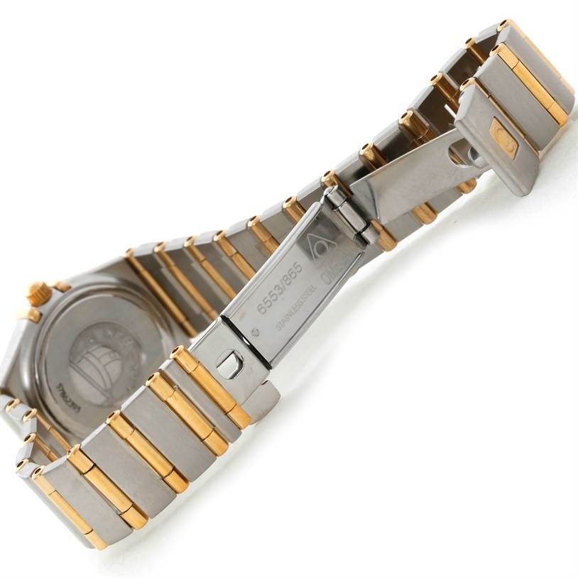 The image shows the clasp and part of the band of the Omega 1267.75.00 Women's Steel and Gold (two tone) Mother of Pearl Dial 1267.75.00 Women's Steel and Gold (two tone) Mother of Pearl Dial Constellation My Choice Steel Gold Diamond Watch 1267.75.00 model.