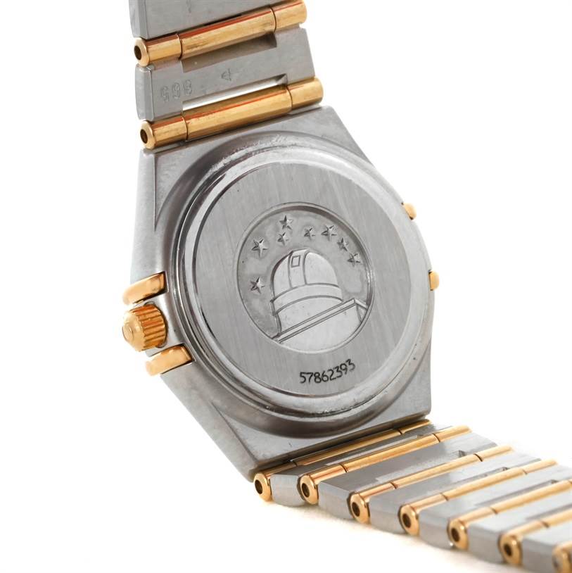 The image shows the back case and part of the bracelet of the Omega 1267.75.00 Women's Steel and Gold (two tone) Mother of Pearl Dial 1267.75.00 Women's Steel and Gold (two tone) Mother of Pearl Dial Constellation My Choice Steel Gold Diamond Watch 1267.75.00.