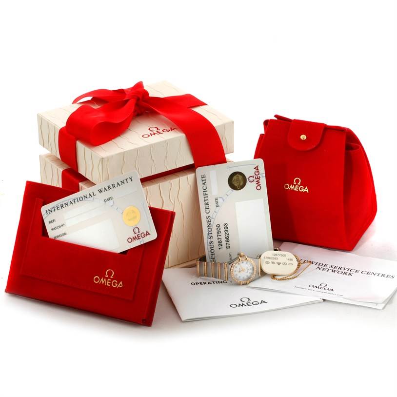 The image shows the Omega 1267.75.00 Women's Steel and Gold (two tone) Mother of Pearl Dial 1267.75.00 Women's Steel and Gold (two tone) Mother of Pearl Dial Constellation My Choice Steel Gold Diamond Watch 1267.75.00, along with packaging, warranty cards, and a case.