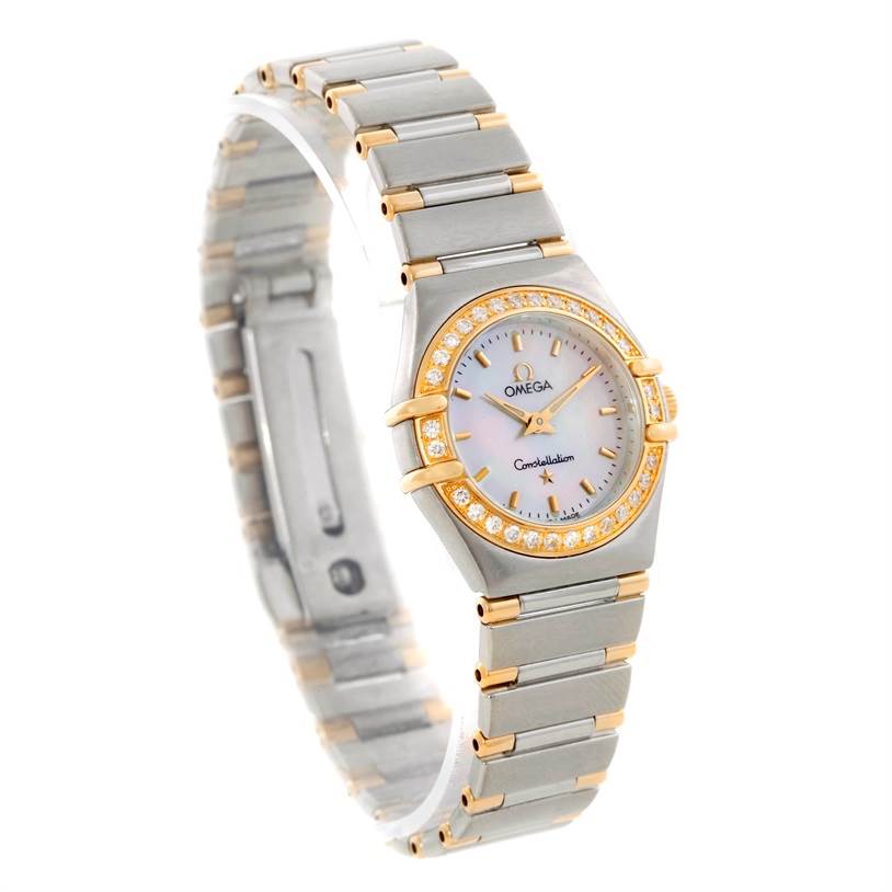 The image shows the Omega 56945066 Women's Steel and Gold (two tone) Mother of Pearl Dial 56945066 Women's Steel and Gold (two tone) Mother of Pearl Dial Constellation Mini Steel and Gold Diamond Watch at a three-quarter angle with its face, bezel, and bracelet visible.