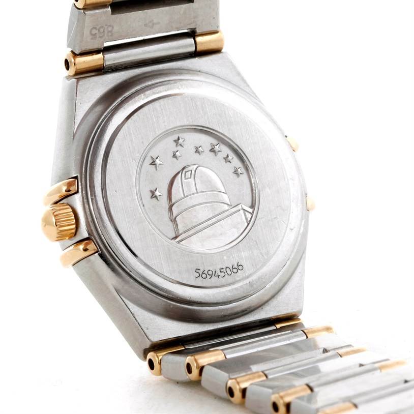 The image shows the back case and part of the bracelet of the Omega 56945066 Women's Steel and Gold (two tone) Mother of Pearl Dial 56945066 Women's Steel and Gold (two tone) Mother of Pearl Dial Constellation Mini Steel and Gold Diamond Watch.