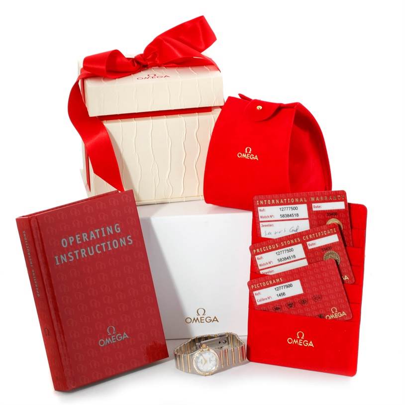 The image shows the Omega 1277.75.00 Women's Steel and Gold (two tone) Mother of Pearl Dial 1277.75.00 Women's Steel and Gold (two tone) Mother of Pearl Dial Constellation My Choice Steel Gold Diamond Watch 1277.75.00, its packaging, operating instructions, and warranty cards.