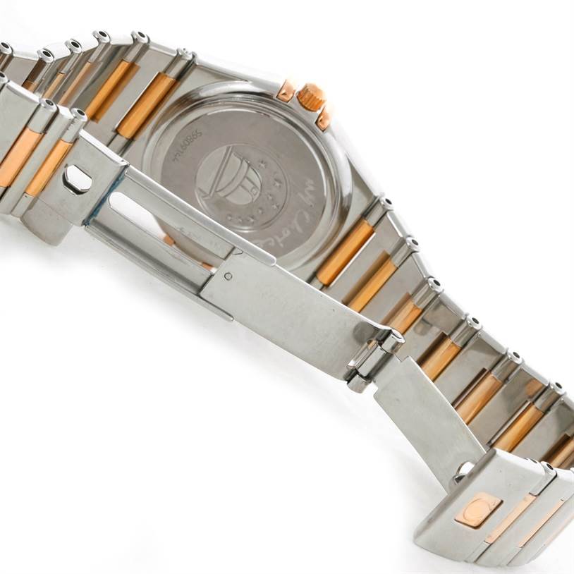 The image shows the back case and two-tone steel and rose gold bracelet of the Omega 1358.79.00 Women's Steel and Gold (two tone) Mother of Pearl Dial 1358.79.00 Women's Steel and Gold (two tone) Mother of Pearl Dial Constellation Iris Steel Rose Gold Multi Stone Watch 1358.79.00.