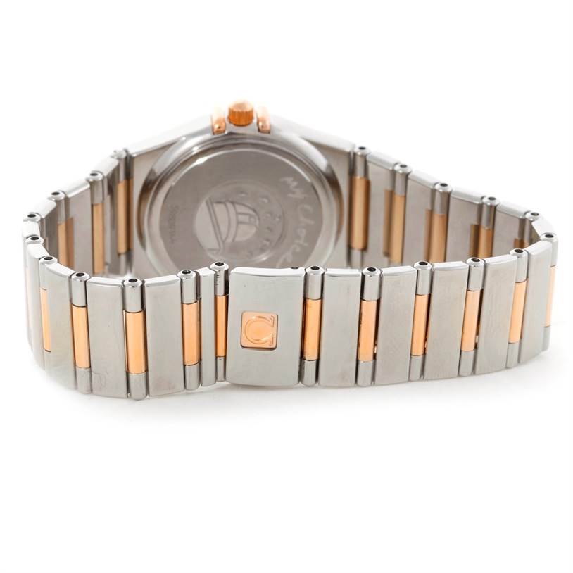 The image shows the back view of the Omega 1358.79.00 Women's Steel and Gold (two tone) Mother of Pearl Dial 1358.79.00 Women's Steel and Gold (two tone) Mother of Pearl Dial Constellation Iris Steel Rose Gold Multi Stone Watch 1358.79.00, focusing on its bracelet and clasp.