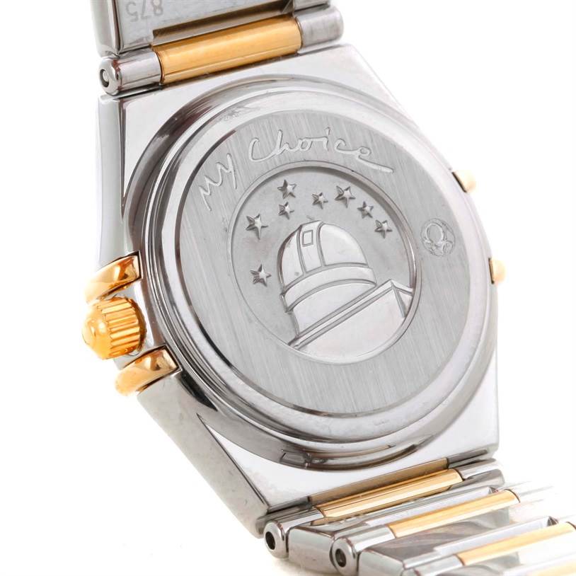 This image shows the back case and part of the bracelet of the Omega 1365.71.00 Women's Steel and Gold (two tone) Mother of Pearl Dial 1365.71.00 Women's Steel and Gold (two tone) Mother of Pearl Dial Constellation Mini Steel Yellow Gold Diamond Watch model 1365.71.00.