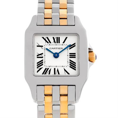 The image shows a frontal view of the Cartier Santos Demoiselle W25066Z6 Women's Steel and Gold (two tone) Silver Dial W25066Z6 Women's Steel and Gold (two tone) Silver Dial watch, highlighting its two-tone bracelet, Roman numeral dial, and blue hands.